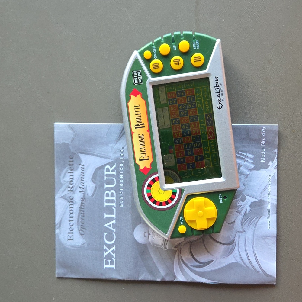 Excalibur Electronic Roulette Handheld Game - Green and Yellow